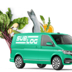 A green van with a colorful assortment of fresh vegetables and fruits displayed on its roof.