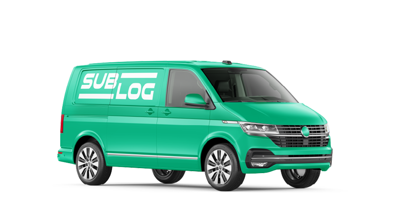 A green van with a white text Sublog painted on the side
